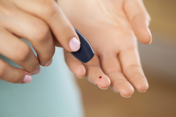 A person meditating in a peaceful natural setting, representing our focus on holistic well-being.